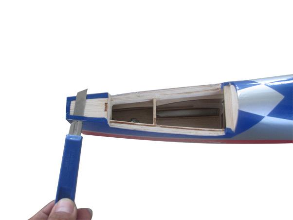 www.seagullmodels.com 2) Using a modeling knife, carefully remove the covering at mounting slot of horizontal stabilizer. 3) Put the stabilizer into place in the position of the fuselage.