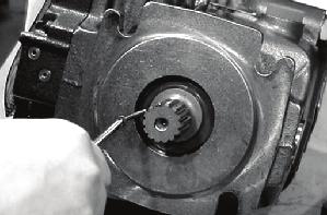 Figure 4. Install screw into hole Figure 5. Pull seal out of pocket iii. Carefully insert the blade of a flat screw driver behind the seal.