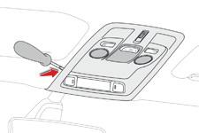 In the event of a breakdown Interior lighting Courtesy lamp with bulbs (W5W) F Using a small flat blade screwdriver, unclip the console assembly surrounding the courtesy lamp.