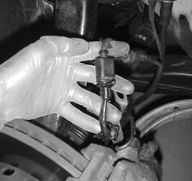 10.Clip the section of wire between the brake pad and the plug.