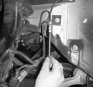 1 27.Using an 11mm and a 14 mm wrench, install the remaining end of the APR brake line. Check brake line clearance by installing the wheel and turning the steering wheel completely in both directions.