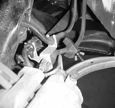 6.Place a brake line clamp on the brake line.