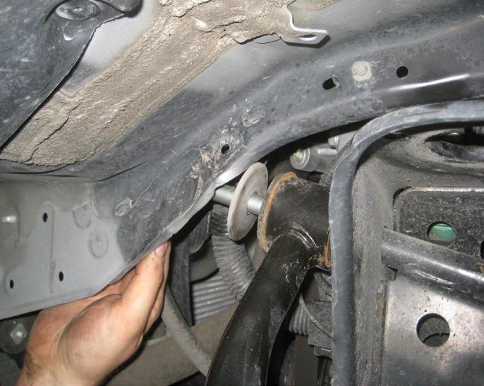 Special note: During removal of the bolt, take special care not to damage the CV boot.