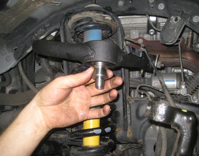 Now install assembled uniball joint into the steering knuckle and secure using the new 9/16 x 5 bolt and hardware.