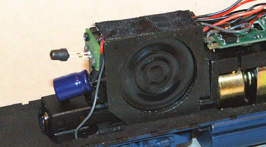 18. On this model it s best to route the capacitor over the speaker enclosure and locate below the rear LED.