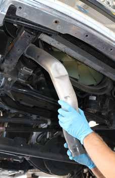 6. Loosen the upper clamp bolts on the right and left boost tubes and remove them from the vehicle.