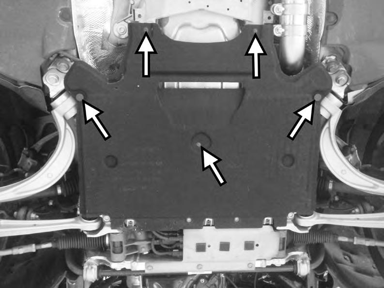 10) Remove the rear belly pan from the car by unscrewing the three