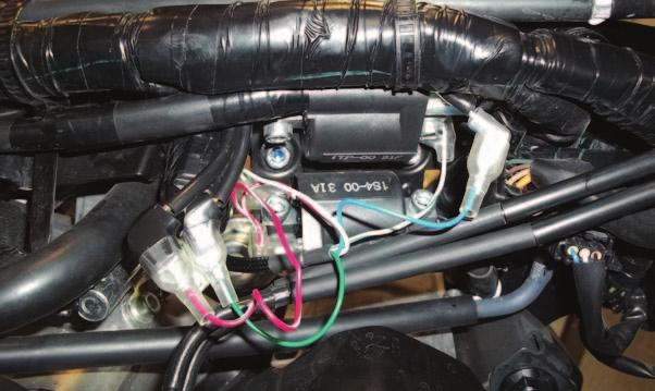 L 17 Plug the pair of RED/WHITE wires with spade terminals of the PCV in-line of the Front Ignition Coil spade and the stock BLACK/RED wire.