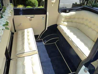 Finished in two tone metallic silver with cream leather interior, navy