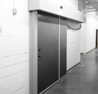 The casing mounted design provides adequate spacing on both sides of the panel to install surface-mounted hardware for handicap access while allowing a portion of the weight of the door to be