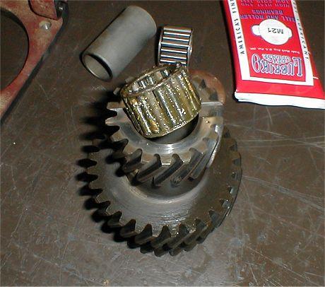 Install the 2 bearings and the center spacer into the cluster gear.