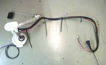 27. Using the supplied Zip ties, secure the red and black primary float transfer wires to the