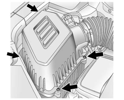 10-16 Vehicle Care 3. Remove the four air cleaner housing cover screws. 4. Pull straight up on the cover, and while holding the cover, remove the air cleaner filter. 5.