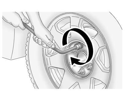 Vehicle Care 10-75 Removing the Flat Tire and Installing the Spare Tire 1. Do a safety check before proceeding. See If a Tire Goes Flat on page 10 62 for more information. 2.