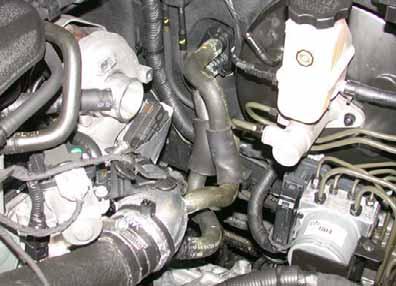 Remove hose of heat exchanger outlet/engine inlet and hose of heat