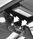 Center the garage door opener activation button over the console door button and press the opener firmly into place.
