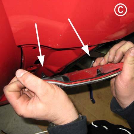 horizontal retainer clips. (Figure C) Remove the plastic fender cover in increments.