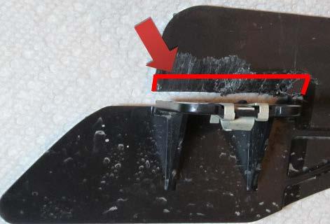 Using a Hacksaw, trim 2-1/8 of the raised tab area so that is flush with the adjacent surface as