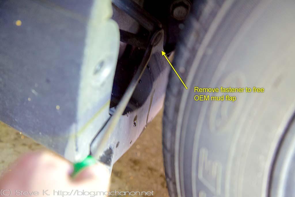 discard the mud flap and fastener once they are free: Remove