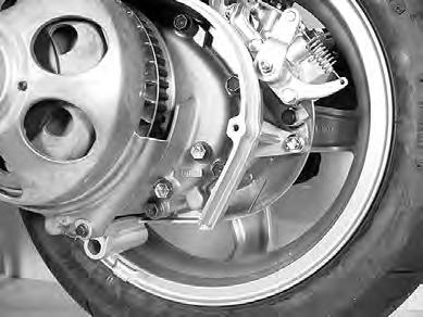 TRANSMISSION OIL REPLACEMEMT Keep the motorcycle upright with the center stand. Remove the left side leg shield. (!