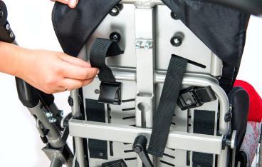 Upper belts from H harness should be inserted into grooves from wheelchair's backrest (fig.