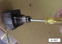 Place a screwdriver over the solenoid. 3. Momentarily activate the control switch in the DOWN position. The screwdriver should be attracted to the magnetic field created by the solenoid. 4.