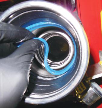 Install the high pressure seal into the seat that is on the other side of the wear rings.