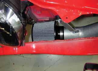 Install the front bumper support using the 8 previously removed bolts. Ensure the air filter does not contact any part of the vehicle. o. Position the AEM intake for best fitment.