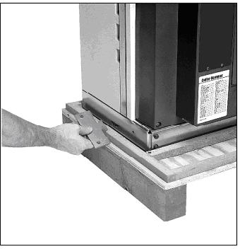 Effective: November 2017 Page 13 Figure 3-3 Optional Lifting Sling Shown In Each Rectangular Lifting Hole On 40kA Breaker Figure 3-2 Keyed Shipping Clamp Being Removed From Fixed Breaker 3-2.