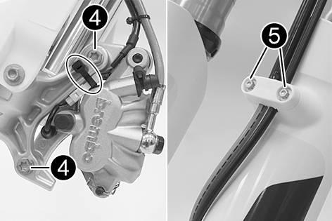 The compression damping is located in the left fork leg COMP (white adjusting screw). The rebound damping is located in the right fork leg REB (red adjusting screw).