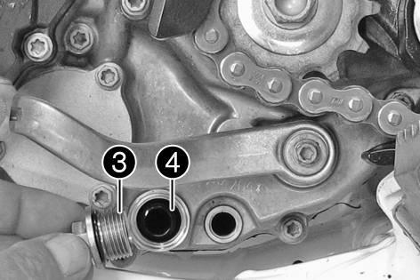 Preparatory work Remove the engine guard. ( p. 68) Park the motorcycle on a level surface. Main work Place a suitable container under the engine.