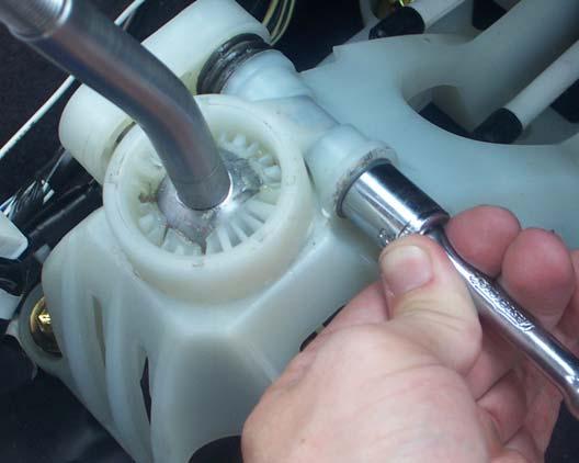 Take special care to properly re-install the spring to its original location. 16.
