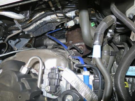 9. With the intake out of the way, you can gain access to the O2 sensor plugs behind the driver s side of the valve cover. There is a blue plug and a black plug. Unplug them both. 10.