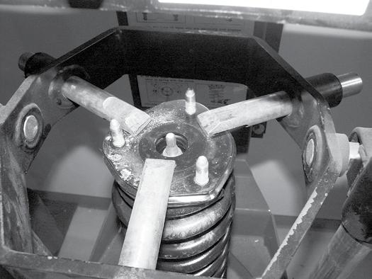 Figure 19 47. Place the provided preload spacer (01278) between the plastic coil seat and the rubber isolator Figure 20. Figure 20 48.