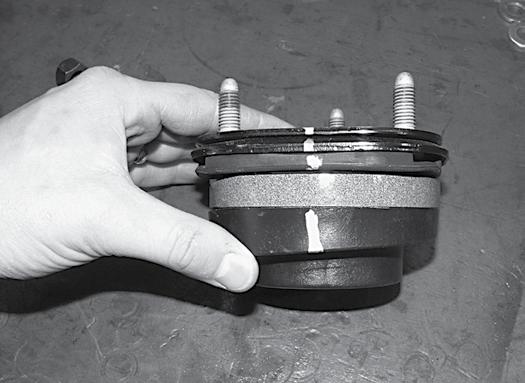 4 inch kits only: The upper strut mounting plate must be rotated 180 degrees. Make an indexing mark on the coil at the top winding by the stud that faced 'out' on the vehicle.