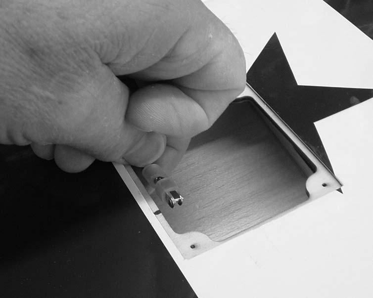 Move the flap down and install the pushrod on the flap horn. IMPORTANT!