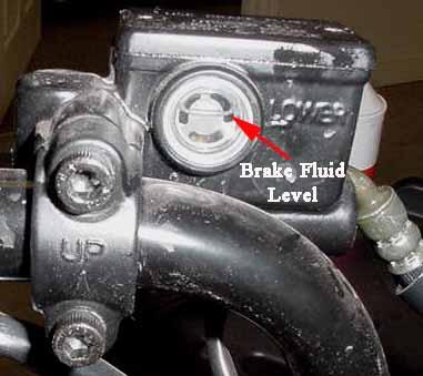 Adjust the brake cable so that the lever has zero free play and a minimum clearance of ½ between the lever and the handle grip when the brake is fully applied.