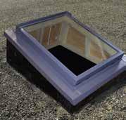 Side and head flashing pieces form a gutter to direct water away from the skylight.