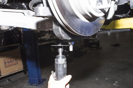 On the lower side, the spindle is secured to the ball joint using the supplied nut.