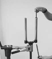 Remove fork from bicycle stand and pour remaining oil into pan.
