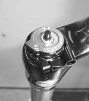Place the Floodgate adjuster knob back onto the compression damper spool shaft.