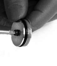 Using a pick, remove blue glide ring and main seal o-ring from the IFP.