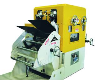 The feeder-straightener is mounted on a heavy-duty cabinet base with +/- 4" passline adjustment.
