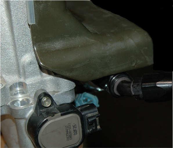 Connect one of the AN-06 90-degree hose ends to the closest inlet (side) port on the fuel pressure regulator and a second AN-06 90-degree hose-end to the Banjo fitting located in the rear of the
