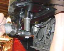 Take the rear braces and insert a ½" spacer between the