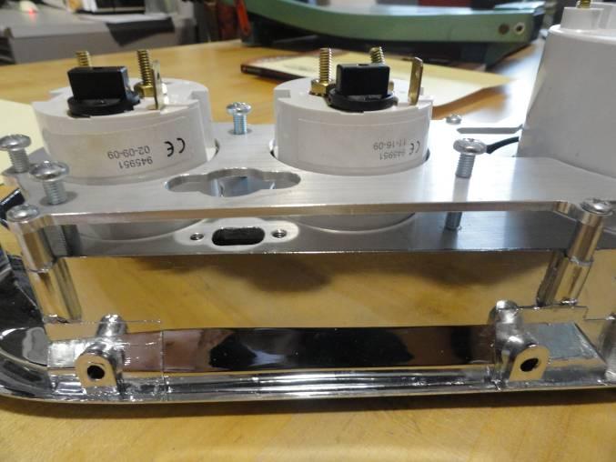 Place the 7/16 aluminum spacers between the mounting panel and the plastic gauge bezel on the top four mounting holes. See Figures 3, 4 & 5.