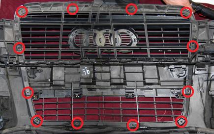 A total of 12 T20 torx screws secure the grille to the bumper 
