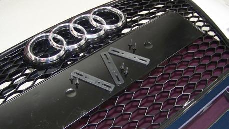 Step 2 Your factory Audi rings must be reused for your new grille.