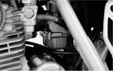 (2) The engine serial number is stamped on the lower left side of