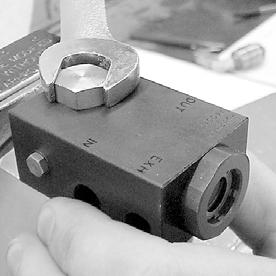The use of a strap wrench or a pipe wrench may be needed. 7. Insert the new Valve Bushing through the new DVOA (see fig. 2). The markings on top of the DVOA must be facing up.